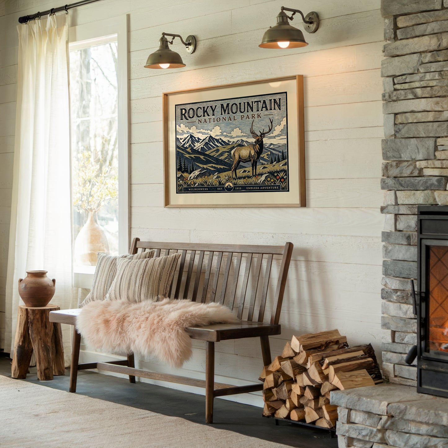 Cozy living room with a wooden bench, fireplace, and Rocky Mountain National Park poster.